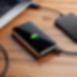 Modern and sleek cell phone power bank on a wooden desk