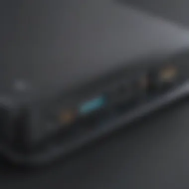 Close-up of gaming laptop charging from an external battery with charging indicator