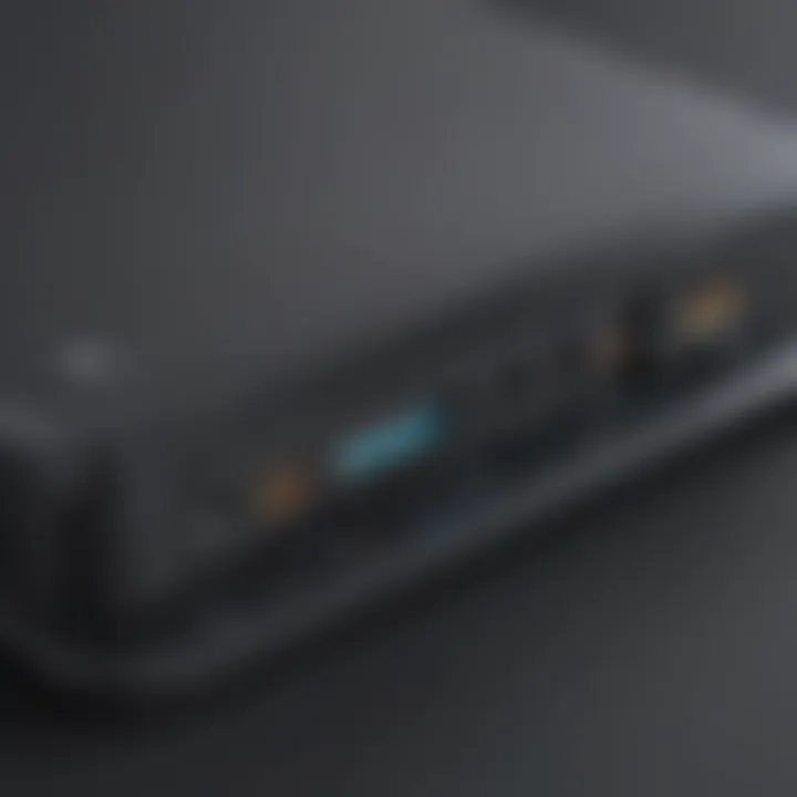 Close-up of gaming laptop charging from an external battery with charging indicator