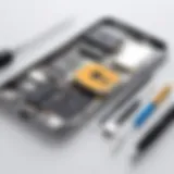 A detailed view of an iPhone disassembled with tools