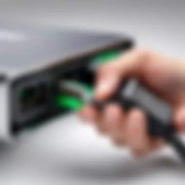 Acer Aspire Charging Connector Inspection Hand holding Acer Aspire charging cord connector