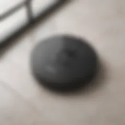 Sleek robotic vacuum cleaner on tiled floor