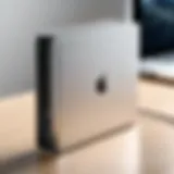 Close-up of an external hard drive connected to a MacBook