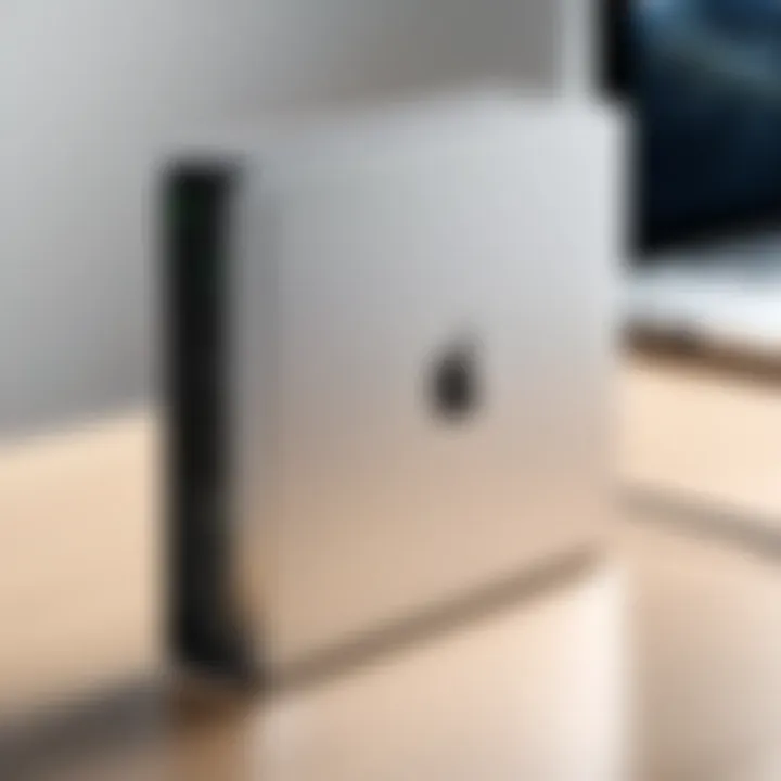 Close-up of an external hard drive connected to a MacBook